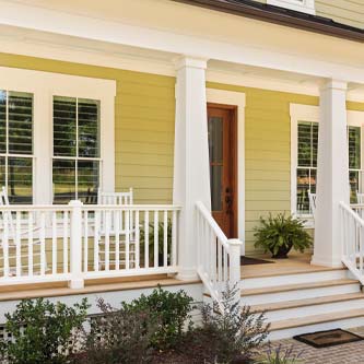 white deck with yellow house