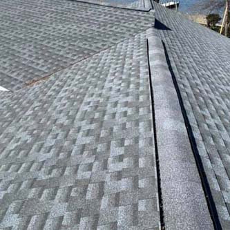 Gray repaired shingled roof.
